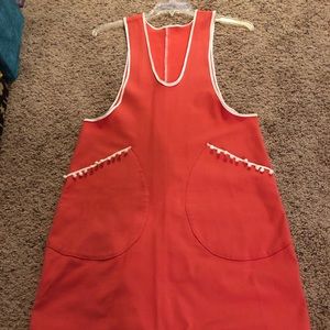 Homemade pinafore dress with pompon details